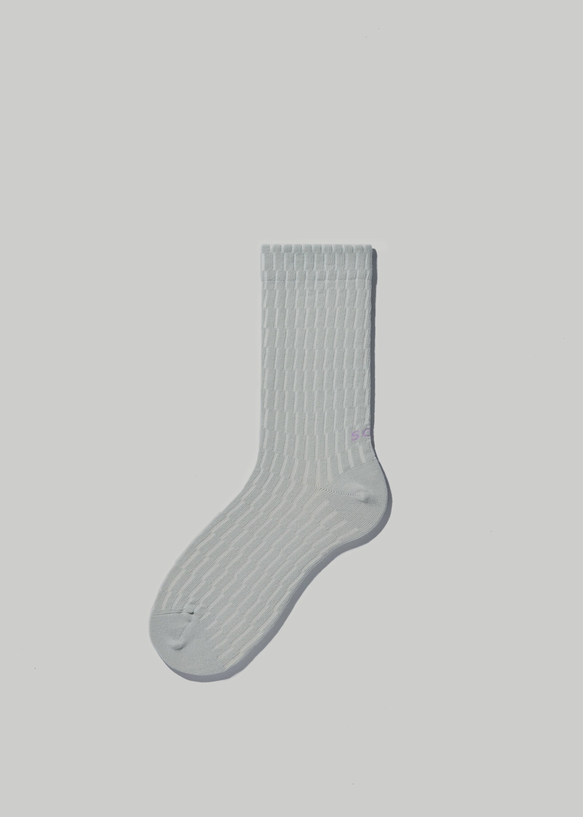 Shifting Grid socks in Pale Grey